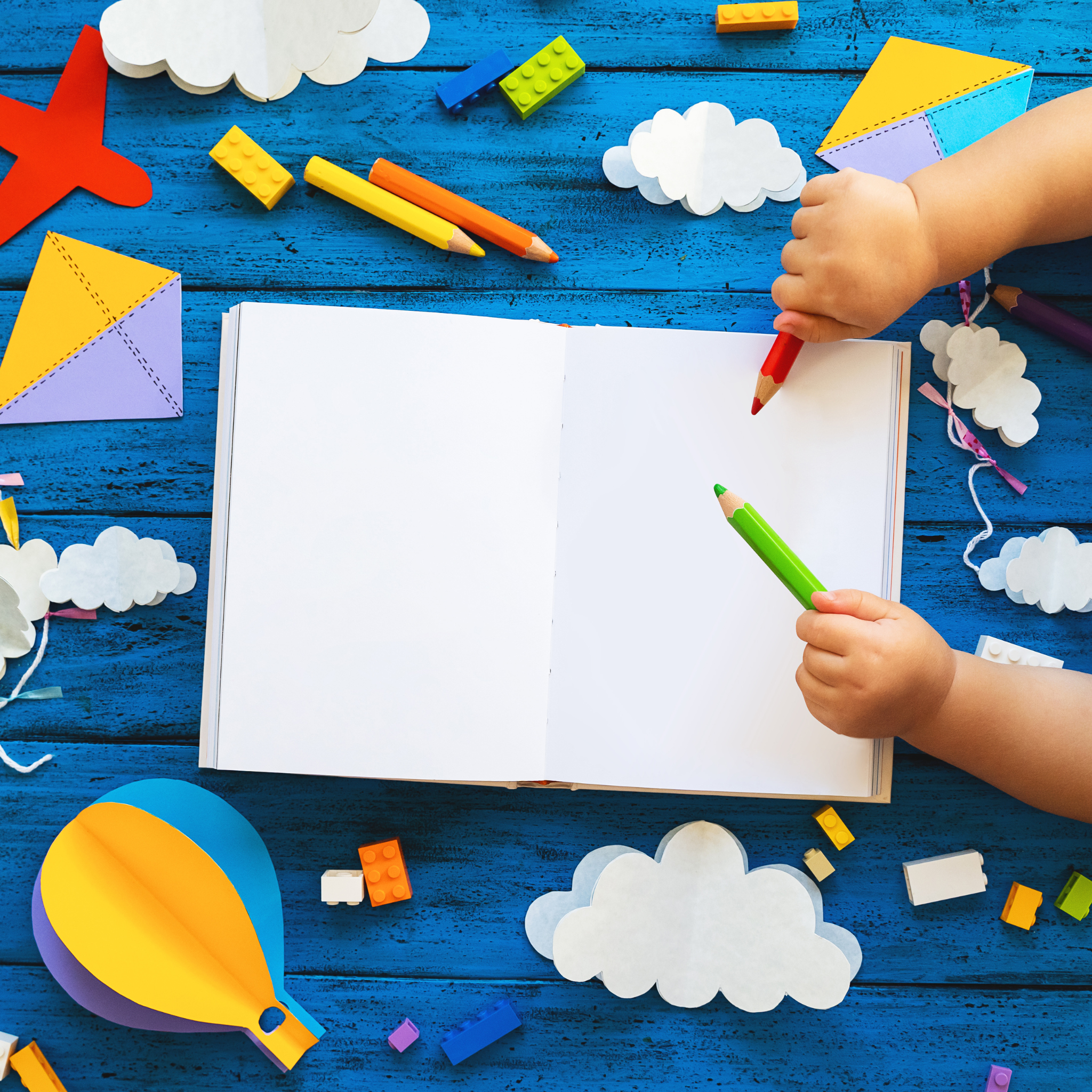 Child decorating colorful cupcakes with sprinkles
